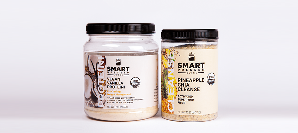 Image of a white backdrop with 2 bottles of protein shakes